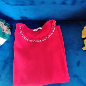 Mercer Street Studio Jewel Red Knit Sweater. Contemporary trim necklace at neck.